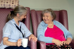 Cartref Care Home - Resident Smiling at Care Worker