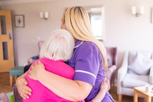 St Helens Hall Carer hugging resident