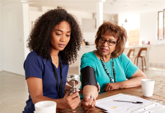 Agape Medical Health Care carer taking blood pressure