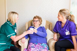 SureCare Salford and Manchester, eldery lady have a cup of tea 