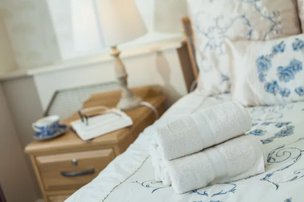 Mill House Care Home in Witney, Bedroom with white sheets