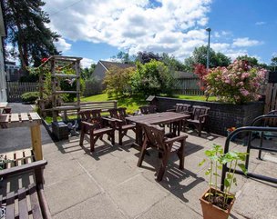 Prestemede Care Home - garden patio area with seating