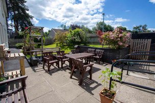 Prestemede Care Home - garden patio area with seating