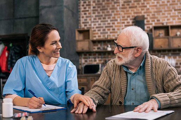 Keeplivin Care in Leicester carer helping client with writing
