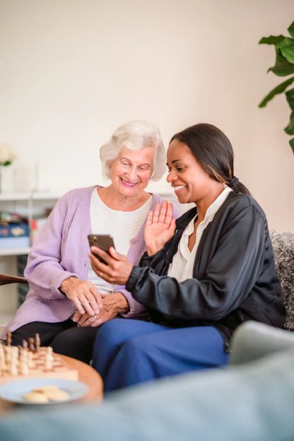 Home Instead Calderdale Live in, carer sitting with client