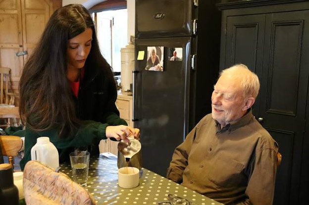 Carer helping making tea