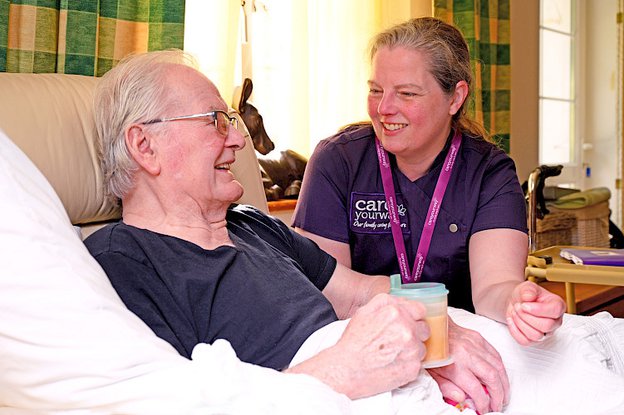 CareYourWay Bury & Rochdale, carer helping eldery man 