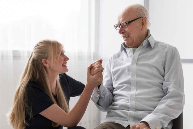 Iflorj Healthcare in Derby - carer holding clients hand