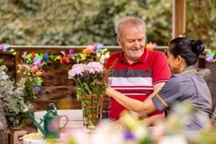 Ashton Grange Residential Home, resident with carer