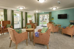 The Chadwick Care Home in Hoddesdon, lounge area with green colours  