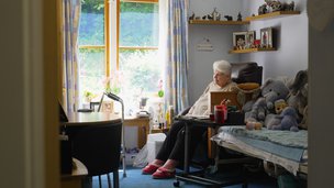 Croft Meadow - Resident relaxing in personalised bedroom