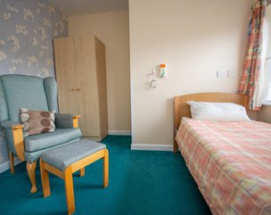 Cartref Care Home, Hereford - Bedroom with Bed and Armchair