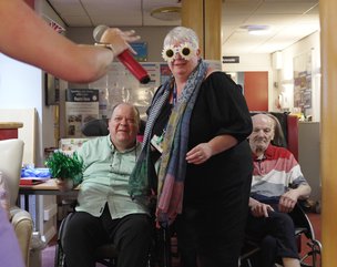 The Belleview ABI Unit - residents taking part in activity in lounge