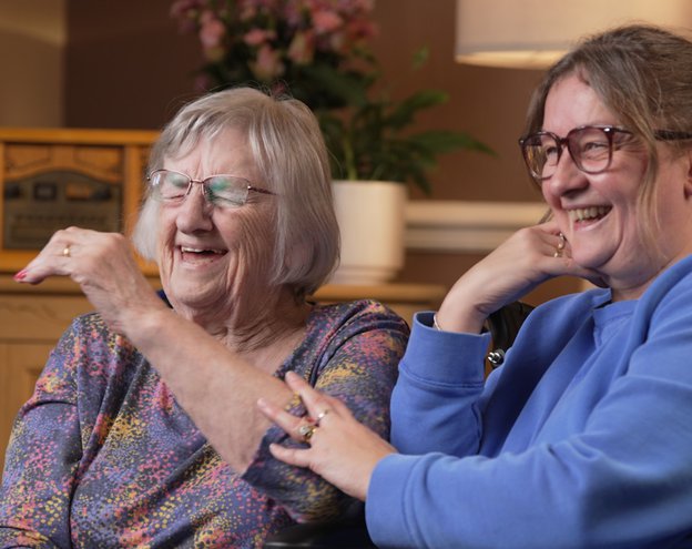 Plas Cae Crwn Care Home - resident and family member laughing