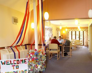Woodside Resource Centre,  Ross-on-Wye, resident sitting at the table 