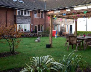 Warmere Court, West Sussex, garden with benches 