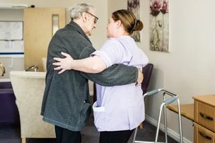 Holly Lodge Care Home in Shildon dancing with carer