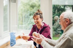 Home Instead North Devon and Exmoor Live in, carer baking with client