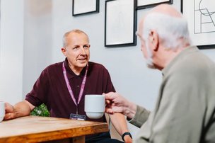 Home Instead North Devon and Exmoor, carer sitting with client