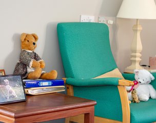 Hillside Lodge - armchair is residents' bedroom