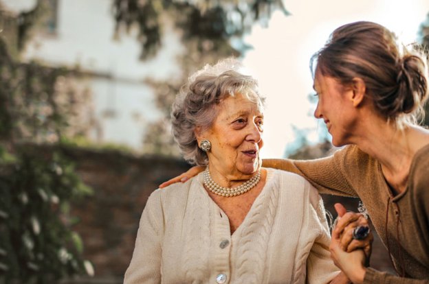 Apollo Care (West Wirral), Carer with elderly outside