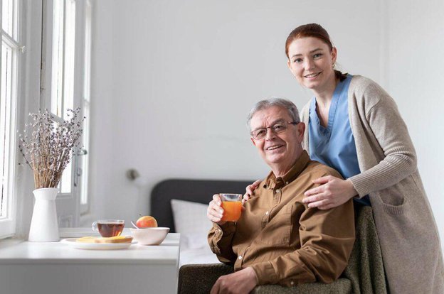 Avida, carer with hugging elderly man. 