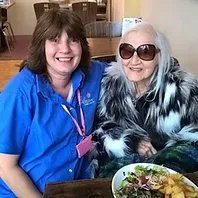 Blossom Home Care, Nottingham. - carer smiling with lady wearing sunglasses
