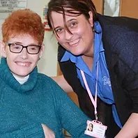 Blossom Care, Nottingham and Derby. Carer smiling with lady 