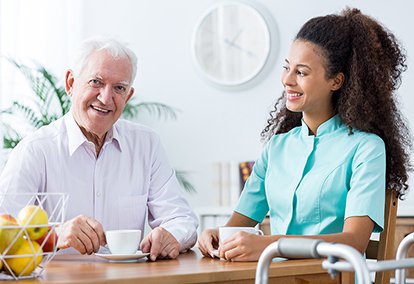 District Home Care, Carer having lunch with elderly