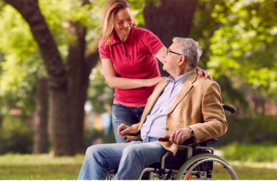 Equicare Services Live in Uxbridge carer with gentleman in wheelchair