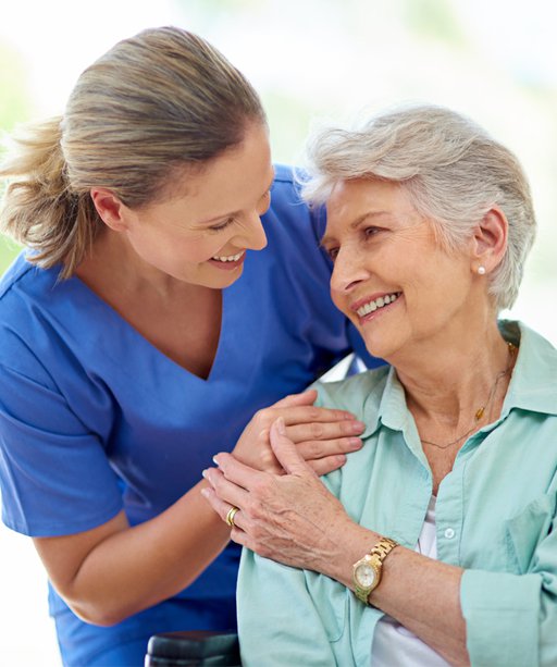 D & L care Solution Live In, lady smiling with carer 