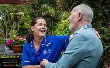 Caremark Mole Valley & Waverley, Carer with elderly in the garden