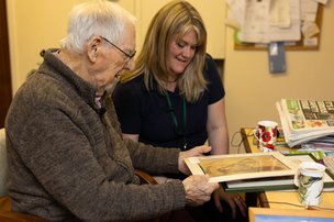 Walfinch Oxfordshire, carer doing art with client