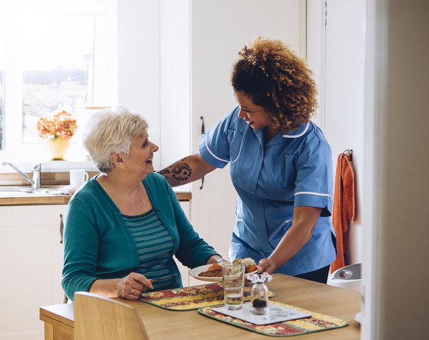 Care Matters Middlesbrough live in carer serving meal