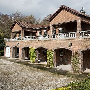 Cold Springs, exterior of home with pillars 