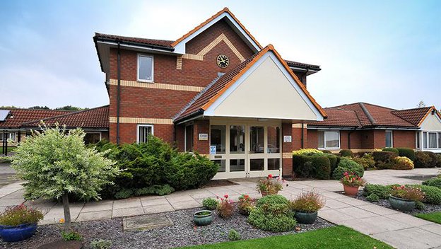 Colton Lodges, front of home 