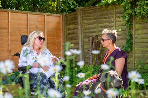 Right at Home Solent, caregiver and client outside in garden