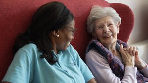 Croft Meadow - Resident and carer smiling at eachother