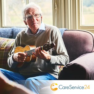 CareService24 in Bournemouth elderly man playing guitar