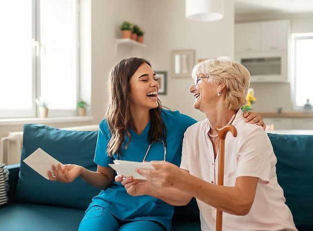 CVC Services Ltd Carer and Client Laughing Together