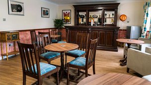 Cwrt-Clwydi-Gwyn, dining area with blue chairs 