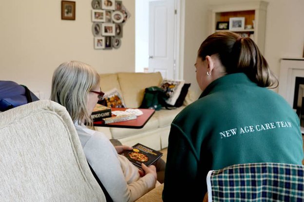 carer helping with reading books