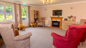 Maple Leaf, Derbyshire, lounge area with red arm chair 