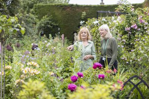 GoodOaks Homecare Sussex South, carer with lady in the garden pointing 