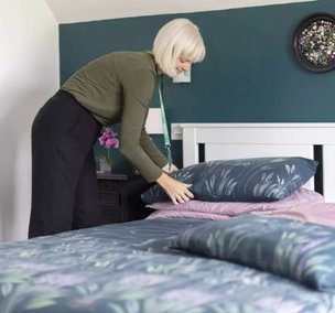 GoodOaks Homecare Sussex, carer making the bed 