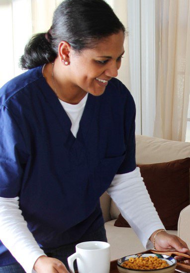 Green Arrow Care, London, carer with a tray of food