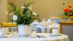 Greenfield Park, dining table with white table sheet 