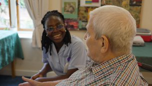 Hillside Lodge - Carer sitting with resident