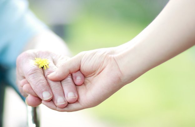 Routes Healthcare Merseyside, holding hands 