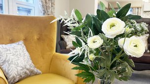 Hollymere House General Nursing Home in Crewe,  lounge and flowers